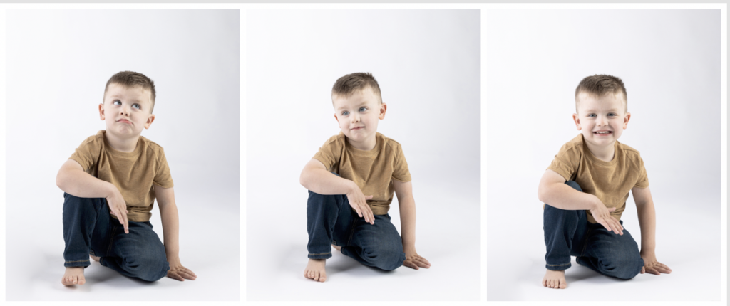 boy sits with silly faces in jeans and tan shirt